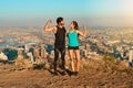 Find your strong. Full length shot of a young couple flexing their muscles while out for a workout.