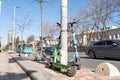 Findikli, Istanbul, Turkey - 02.26.2021: Turkish electric scooter rental companies products parked near city road green scooter