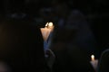 Finding the light in dark. a haza candlelight vigil find each other in darkness, blur background in hong kong victoria park in 64