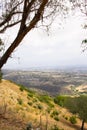 Landscape view of the surrounding area from the top of the hill overlooking a cityscape in the distance Royalty Free Stock Photo