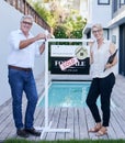 Finding the perfect retirement home. Cropped portrait of a mature couple holding their keys while standing in front of a