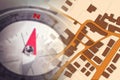 Finding the right home for you! - Concept image with a city map, buildings, roads and navigational compass