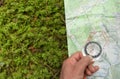 Finding the right position in the forest with a compass Royalty Free Stock Photo