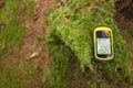 Finding the right position in the forest with a gps Royalty Free Stock Photo