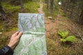 Finding the right position in the forest with a map Royalty Free Stock Photo