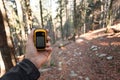 Finding the  right position in the forest via gps Royalty Free Stock Photo