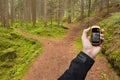 Finding the right position in the forest via gps Royalty Free Stock Photo