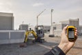 Finding the right position inside a construction site via gps blurred background Royalty Free Stock Photo