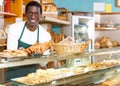 Fine African American man offering pastry