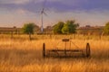 Fine art, artwork. Digital abstract oil painting of an antique hay rake in a farmers field at sunset Royalty Free Stock Photo