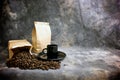 Fine art coffee cup whole beans and bags Royalty Free Stock Photo