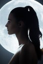 Fine Art Fashion Studio Portrait of Woman at Full Moon Royalty Free Stock Photo