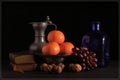 Fine art Still life image of oranges, grapes and nuts