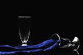 Fine art Still life image of two glasses and a royal blue silk cloth Royalty Free Stock Photo