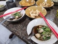 Fine Cut White Rice Noodle Thicken Soup topping Sliced Pork and Pork Ball eat with pork snackThai Crispy wonton food