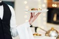 Fine dining, food and waiter serving at a restaurant for a luxury valentines day or anniversary meal. Formal Royalty Free Stock Photo