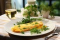 Fine, folded omelette, refined with dill, next to a glass of chilled white wine.