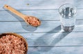 Fine-grain pink Himalayan salt and crystals - Glass of water