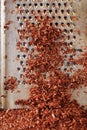 Fine grated dark chocolate on grater Royalty Free Stock Photo