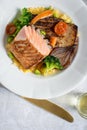 Grilled Salmon Fillets with Vegetables on White Plate