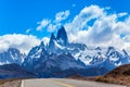 Fine highway to the grandiose Mount Fitz Roy. Argentine Patagonia. Summer sun and blue sky above the prairie. The concept of