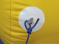 Yellow buoy texture with blue rope and nautical knot called