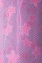 Fine mesh netting with fluffy pink stars fabric or material, suitable for baby background Royalty Free Stock Photo