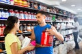 Fine salesman offering supplements to woman Royalty Free Stock Photo