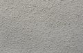 Fine plaster on the wall. Well visible texture. Royalty Free Stock Photo