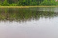 Fine rain drizzles on the river in summer, cloudy weather