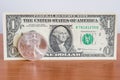 Fine silver one dollar and paper one dollar Royalty Free Stock Photo