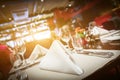 Fine table setting with yellow light flare Royalty Free Stock Photo