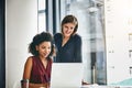 Fine-tuning their latest plans. two businesswomen working together on a laptop in an office. Royalty Free Stock Photo