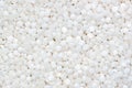 Fine white polymer granules Royalty Free Stock Photo