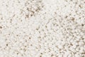 Fine white polymer granules Royalty Free Stock Photo