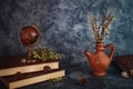 Fineart concept shot. Stilllife with rustic books  with flowers and globe on grey backgrouns Royalty Free Stock Photo