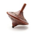 A finely-crafted wooden spinning top with intricate carvings on its surface. The design Royalty Free Stock Photo