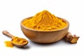 Finely dried Turmeric (Curcuma longa Linn) powder in a wooden bowl and spoon with rhizome (root) isolated on white background