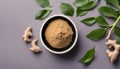 Finely dry Ginger powder in bowl with green leaves isolated on colored background. top view flat lay Royalty Free Stock Photo