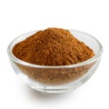 Finely ground cinnamon in glass bowl. Royalty Free Stock Photo