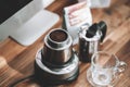 Finely ground coffee and vintage coffee maker moka pot on wooden table at home office Royalty Free Stock Photo