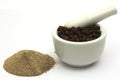 Finely Ground pepper beneath whole peppercorns Royalty Free Stock Photo