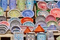 Finely painted and decorated colorful ceramic plates and crockery at a stall in the Sousse souk in the medina, close-up Royalty Free Stock Photo