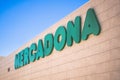 Finestrat, Spain - March 15, 2023: Mercadona supermarket logo on Mercadona store wall. Mercadona is popular supermarket