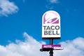 Finestrat, Spain - March 2, 2023: Taco bell logo sign on pole signboard against blue sky. Taco Bell is American-based Royalty Free Stock Photo