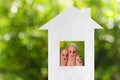 Finger art of a family. Family looking out of the window of the house out of paper Royalty Free Stock Photo