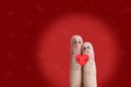 Finger art of a Happy couple. Lovers is embracing and holding red heart. Stock Image