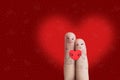 Finger art of a Happy couple. Lovers is embracing and holding red heart. Stock Image