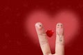 Finger art of a Happy couple. Man is giving heart. Stock Image