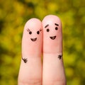 Finger art of a Happy couple. A man and a woman hug on the background of yellow leaves Royalty Free Stock Photo